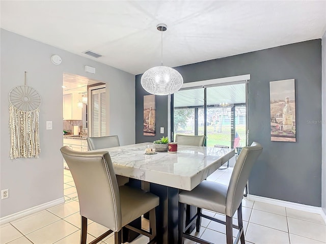 dining room with light tile patterned flooring and sink