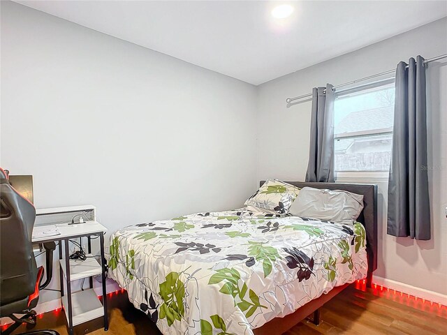 bedroom featuring wood-type flooring