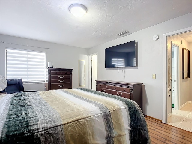 bedroom with light hardwood / wood-style flooring