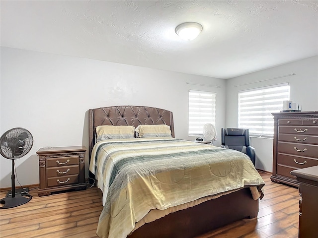 bedroom with light hardwood / wood-style floors