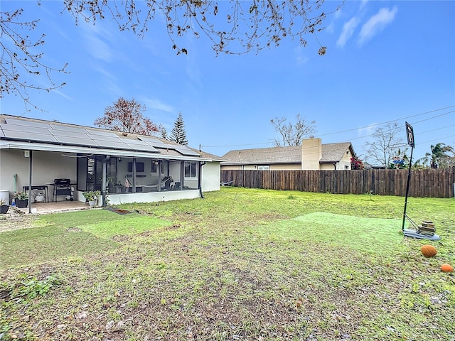 view of yard featuring a patio and a sunroom