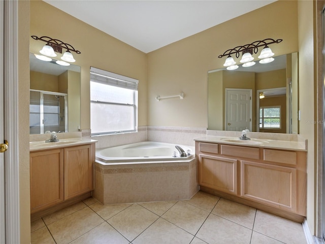 bathroom featuring tile patterned floors, separate shower and tub, and vanity