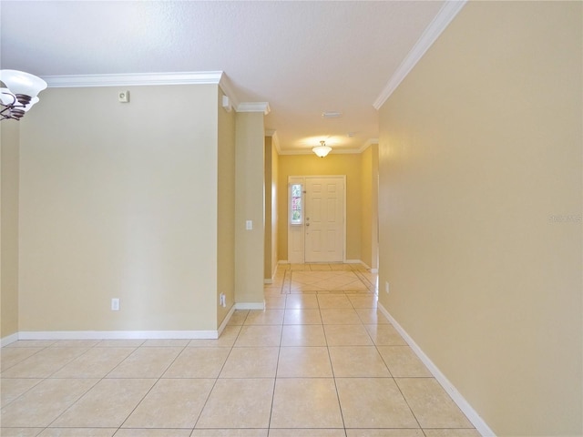 hall with crown molding and light tile patterned floors