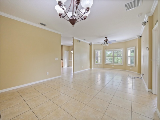 spare room with a barn door, crown molding, ceiling fan with notable chandelier, and light tile patterned floors