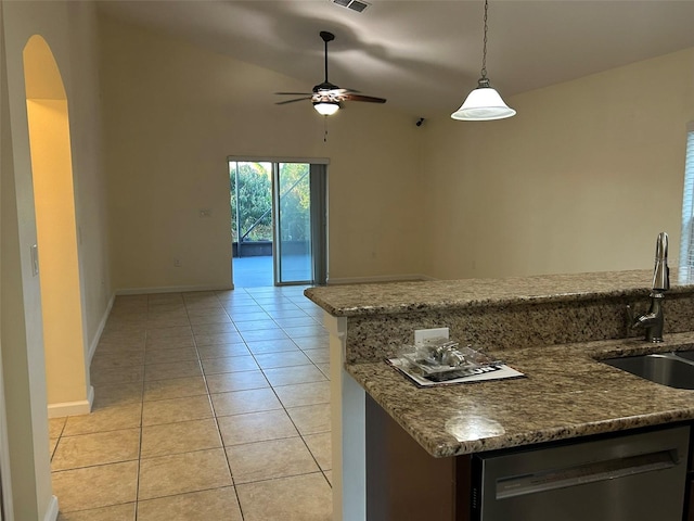 kitchen with stone countertops, dishwasher, hanging light fixtures, and light tile patterned floors