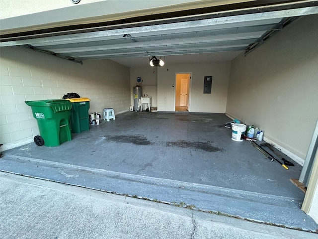 garage with a garage door opener, electric panel, and water heater