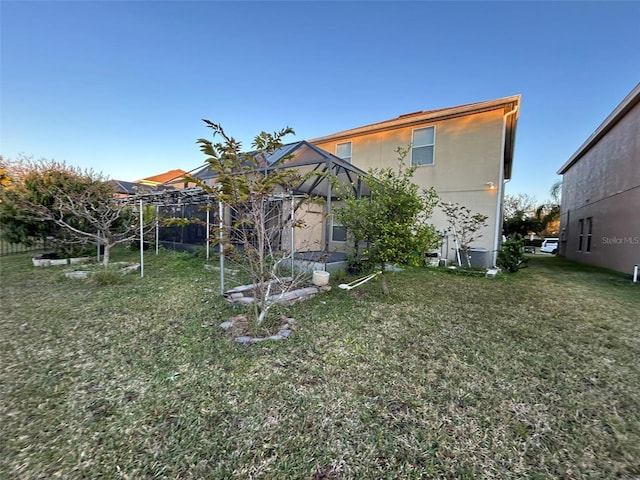 back of house featuring a yard