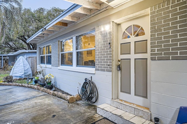 doorway to property featuring a patio