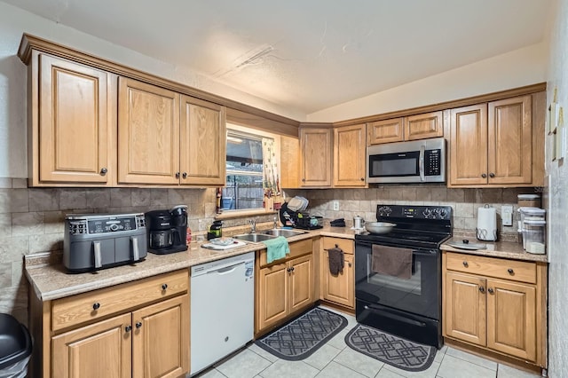 kitchen featuring black / electric stove, white dishwasher, sink, and tasteful backsplash