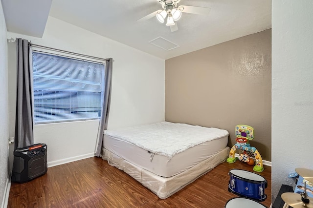 bedroom with dark wood-type flooring and ceiling fan