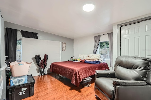 bedroom with hardwood / wood-style floors