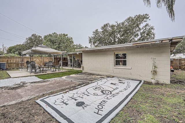 rear view of property with a patio area