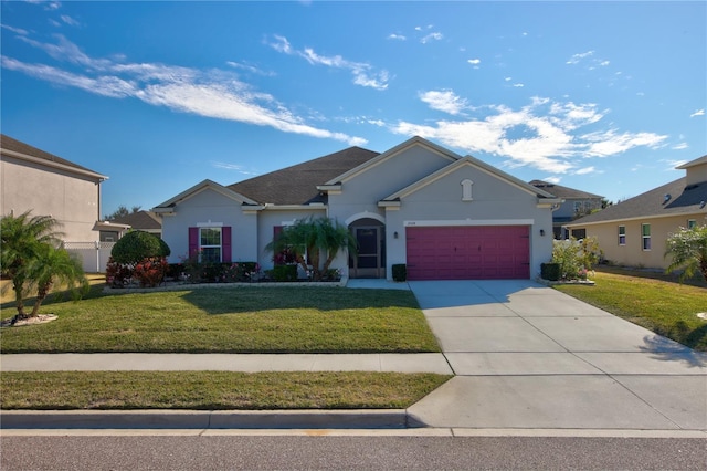 single story home featuring a garage and a front yard