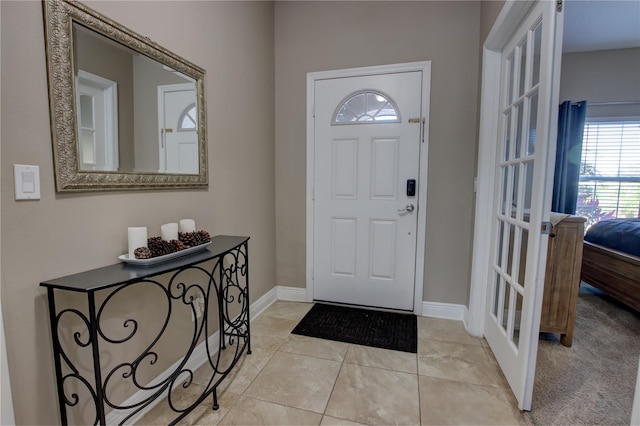 foyer featuring light tile patterned flooring