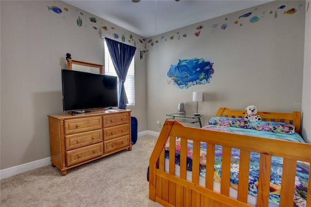 bedroom featuring light carpet