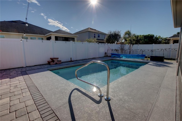 view of swimming pool featuring a patio