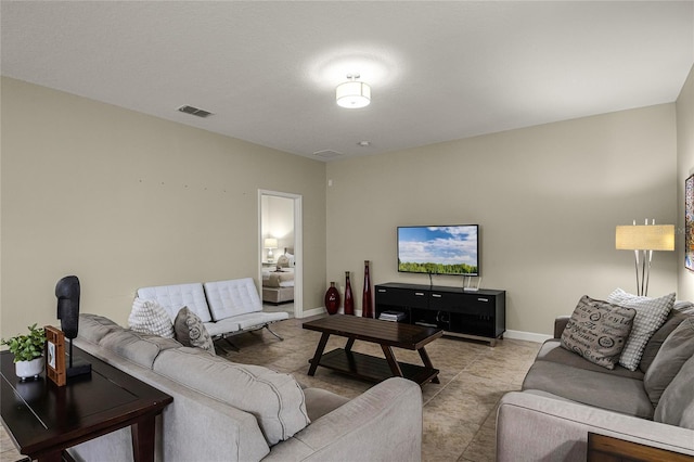 living room with light tile patterned floors