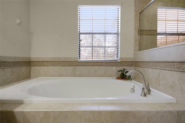 bathroom featuring tiled bath