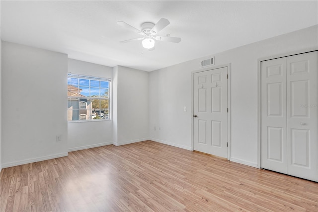 unfurnished bedroom featuring ceiling fan and light hardwood / wood-style floors