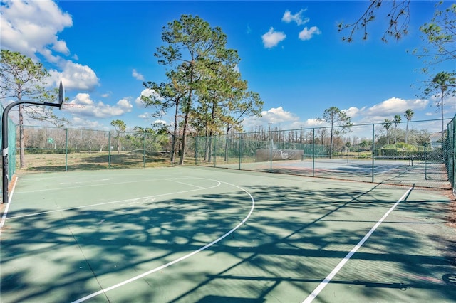 view of basketball court featuring tennis court