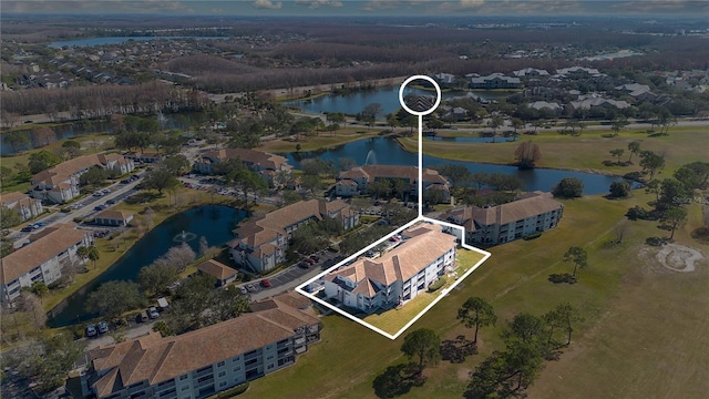 birds eye view of property with a water view