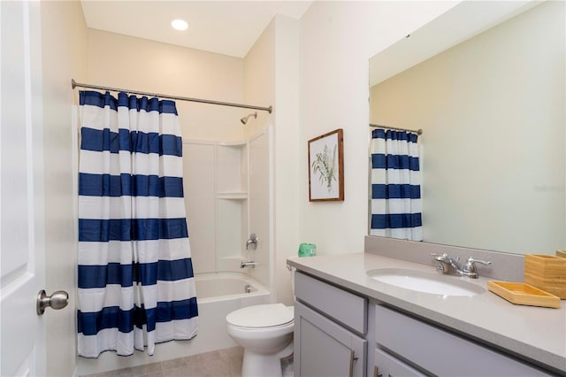 full bathroom featuring vanity, toilet, tile patterned flooring, and shower / bath combo