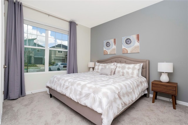 bedroom featuring light colored carpet