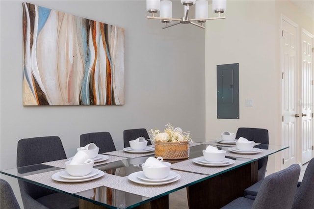 dining area with a notable chandelier and electric panel