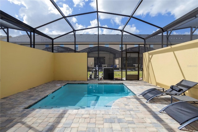 view of pool featuring a patio and a lanai