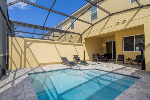 view of pool with a lanai and a patio