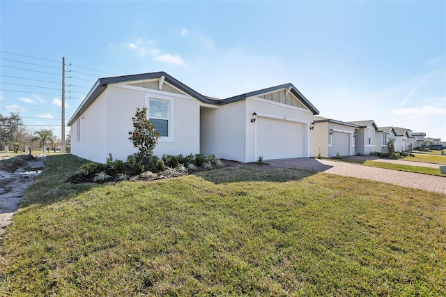 single story home with a garage and a front yard