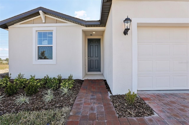 property entrance featuring a garage