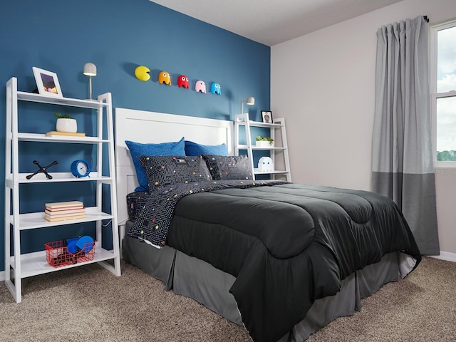 bedroom with carpet floors and multiple windows