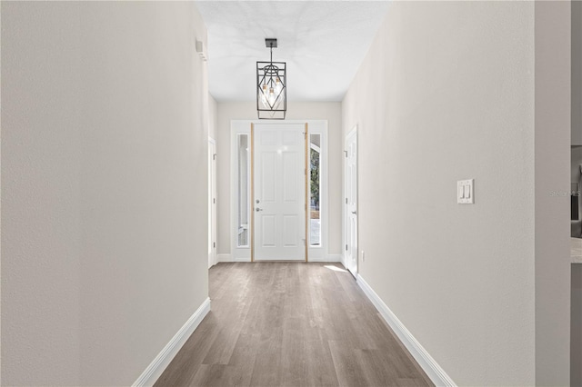 corridor featuring hardwood / wood-style floors