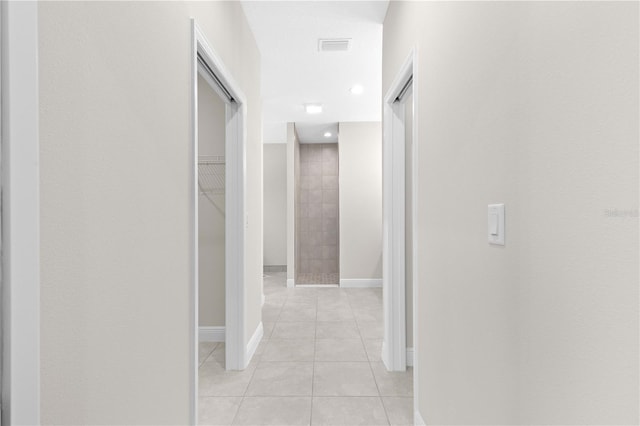 corridor featuring light tile patterned flooring