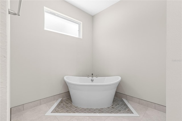 bathroom with tile patterned floors and a bathing tub