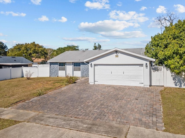 ranch-style home with a garage and a front yard