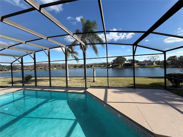 view of pool featuring a patio area, a water view, and glass enclosure