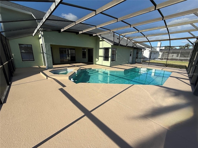 view of pool featuring a lanai, a patio, and an in ground hot tub