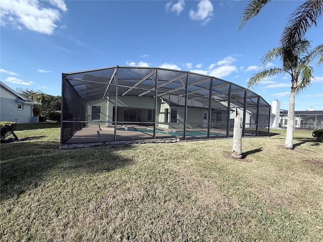 3027 Eagle Lake Dr, Orlando, FL 32837 - back of property with an outdoor pool, a yard, a patio area, and a lanai