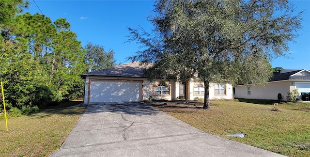 view of front facade with a garage and a front lawn