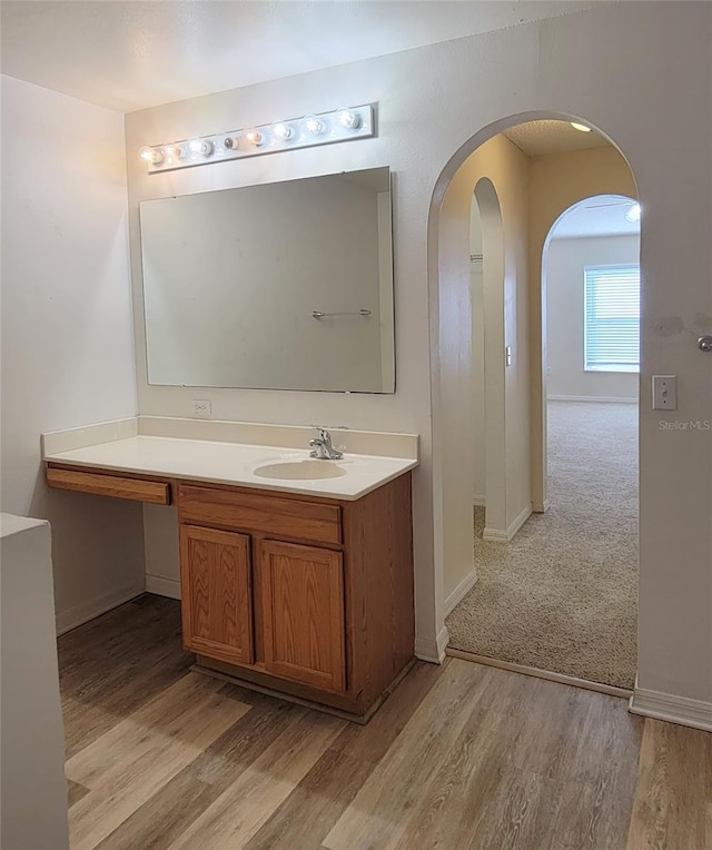 bathroom with vanity and hardwood / wood-style floors