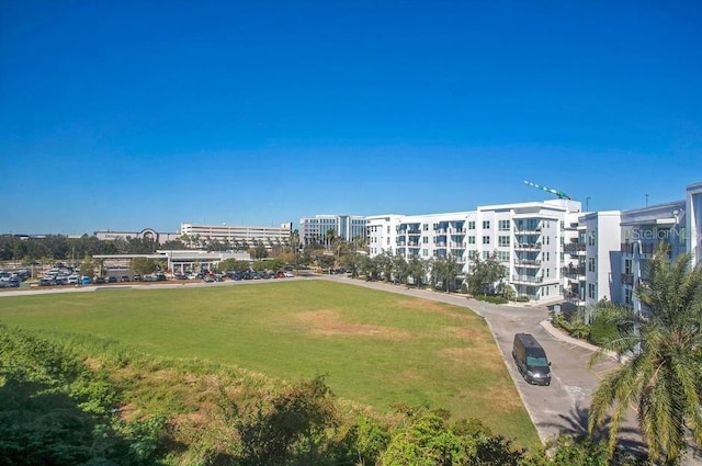 view of home's community with a lawn