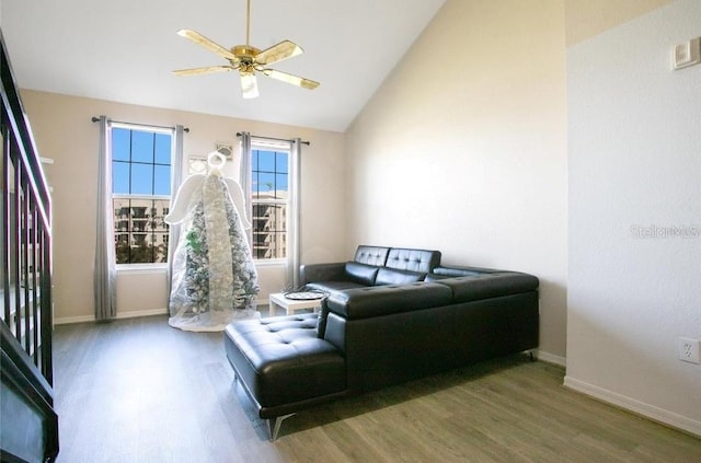 interior space with high vaulted ceiling, dark wood-type flooring, and ceiling fan