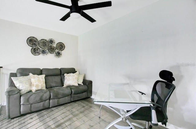 office with light hardwood / wood-style floors and ceiling fan