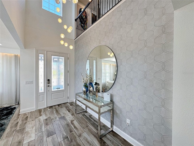 entryway featuring a towering ceiling