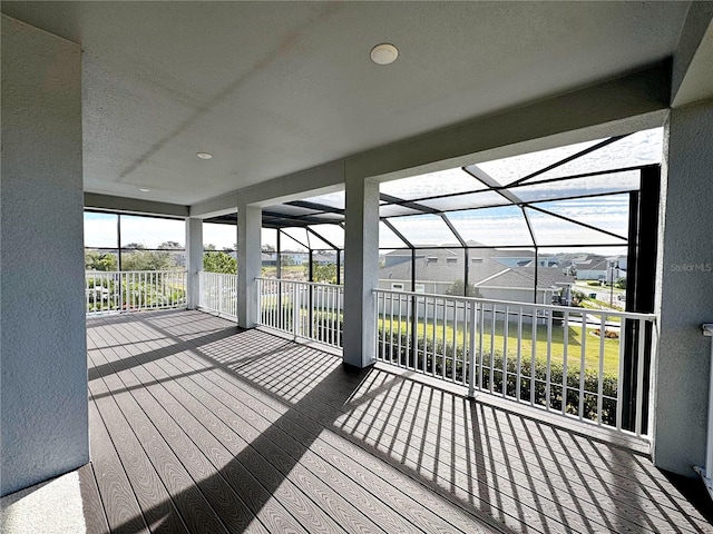 wooden deck with a lanai