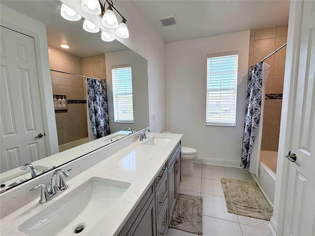 full bathroom featuring shower / tub combo with curtain, vanity, toilet, and tile patterned flooring