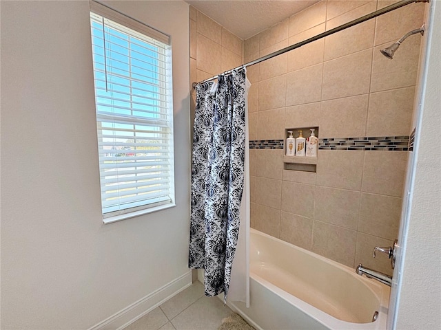 bathroom with tile patterned flooring and shower / bath combination with curtain