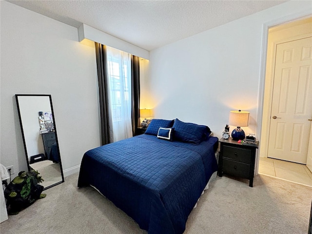 carpeted bedroom with a textured ceiling